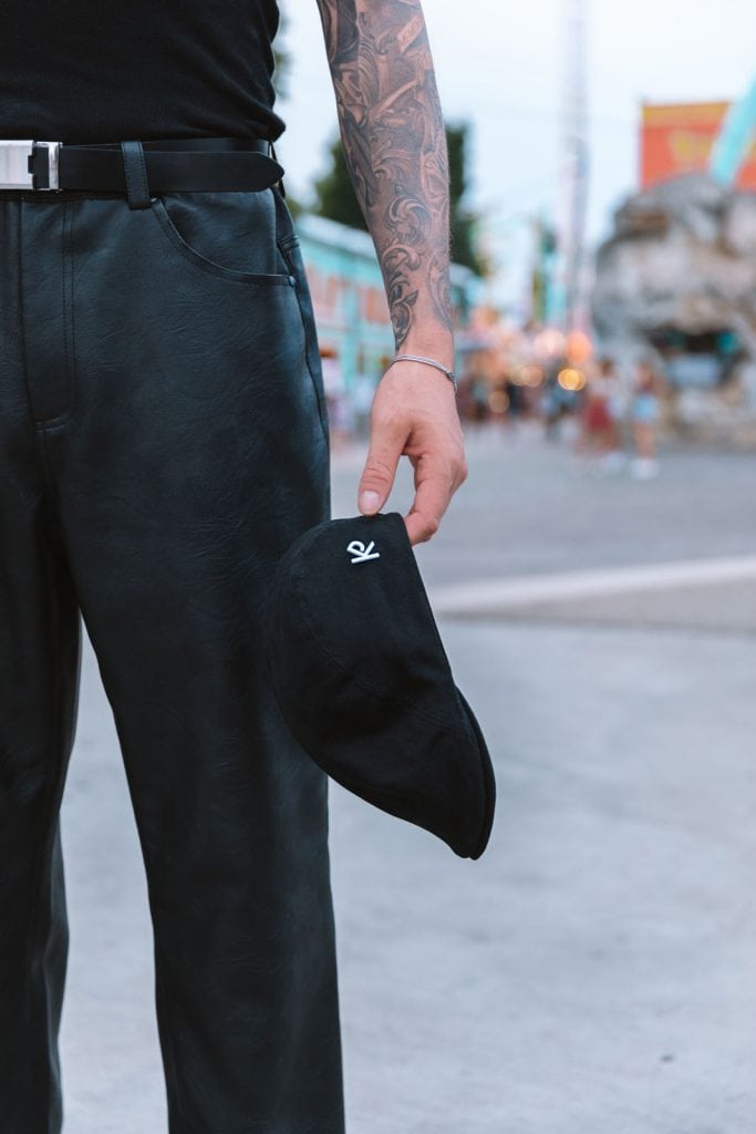 Youthful elegance: A stylish urbanite wears a flat cap with confidence