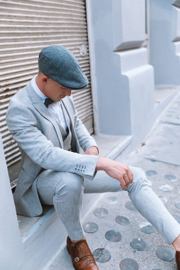 Elegance personified: A gentleman embraces tradition with a classic flat cap