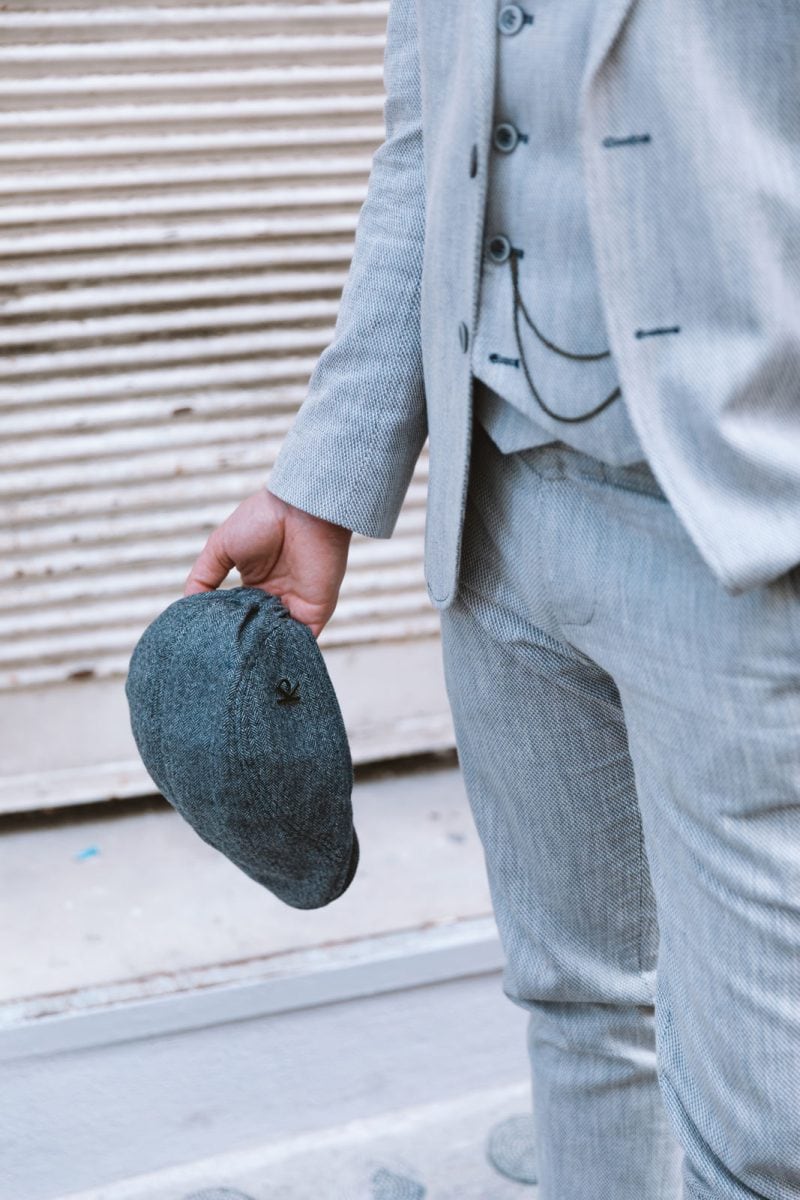 Vintage charm is alive as a man elevates his style with a flat cap